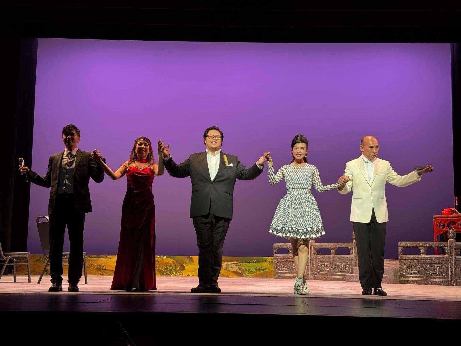 The cast of Sleepless Moon taking a curtain call on stage